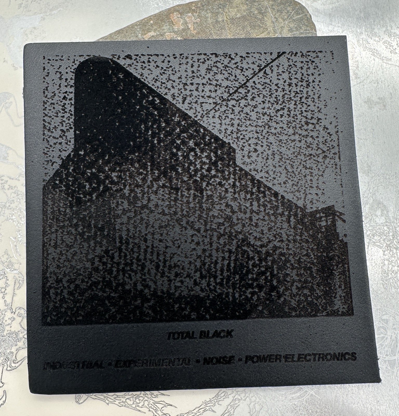 Total Black engraved leather patch.